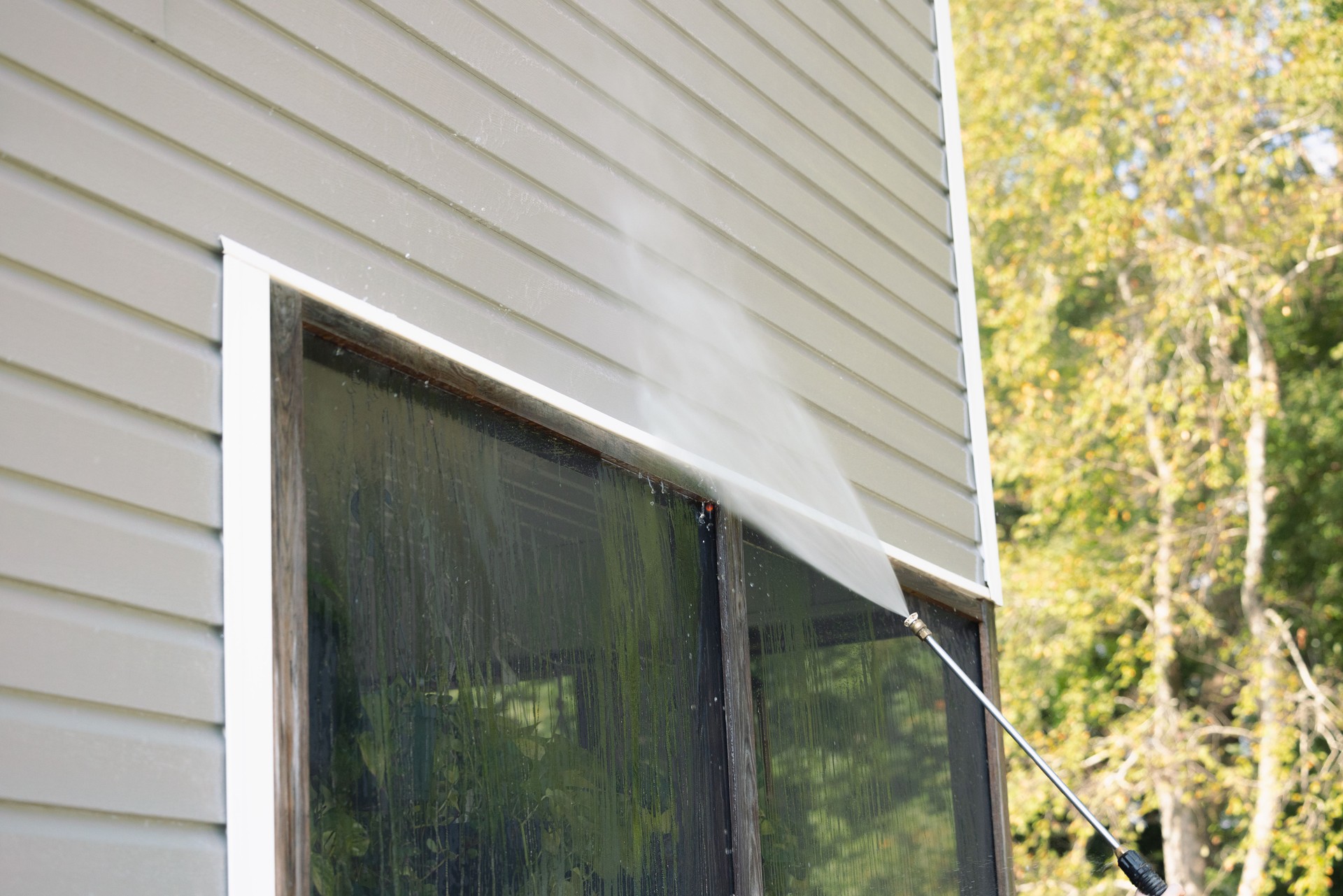 Pressure Washing Vinyl Siding - Above Patio Net - House