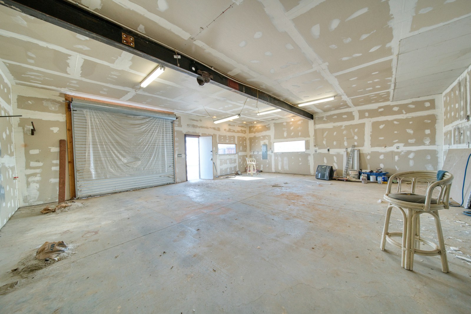 A large room with a lot drywall work